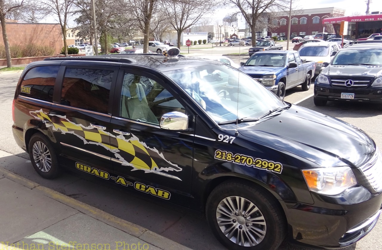 black grab-a-cab Taxi (right)