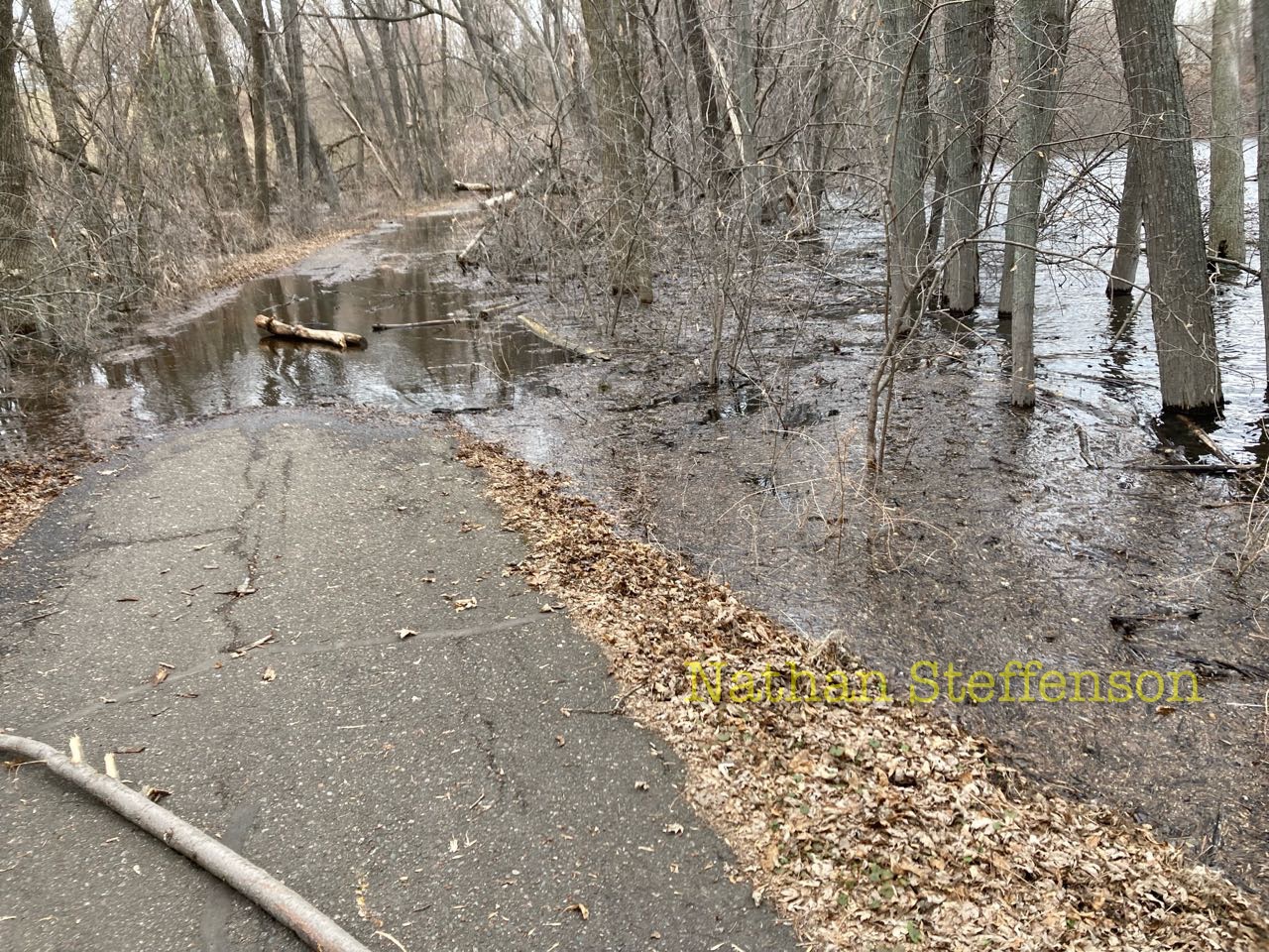 boom lake flowing over trail