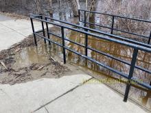 Mississippi River flowing over trail